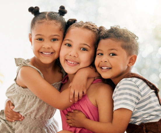 Happy children sharing healthy, confident smiles together