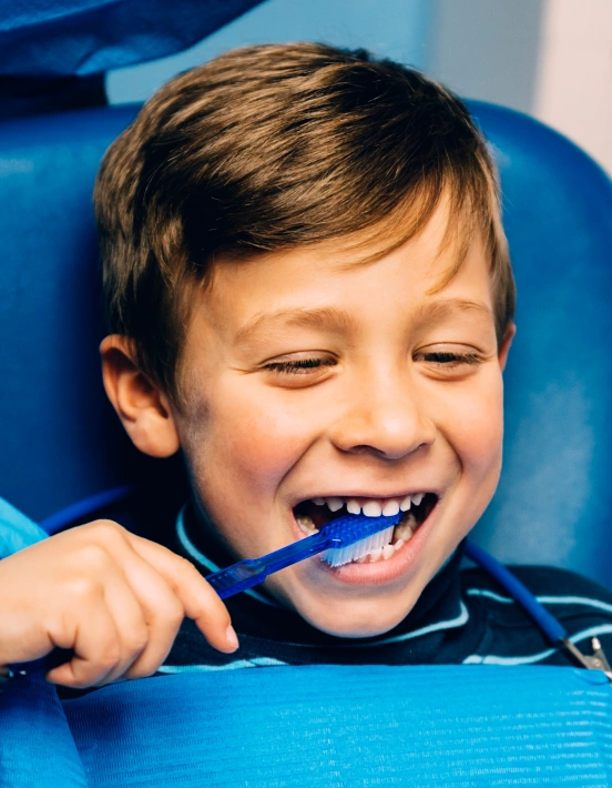 Child practicing healthy brushing habits for a brighter smile